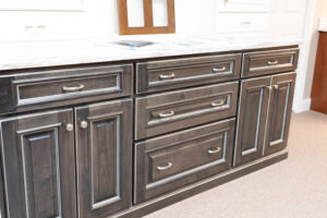 Bathroom vanity display with gray cabinets and white quartz countertop